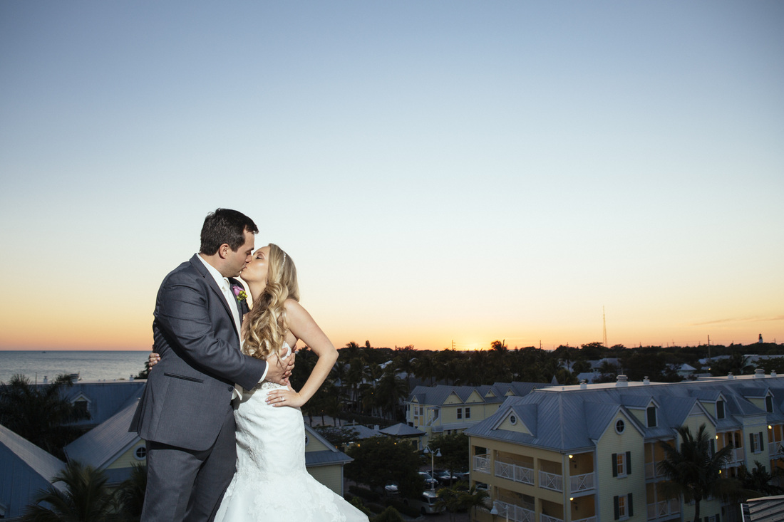 Sunset in Key West, Destination tropical wedding, bride and groom kissing, beautiful view from reach Hotel in Key West, Key West wedding photographer