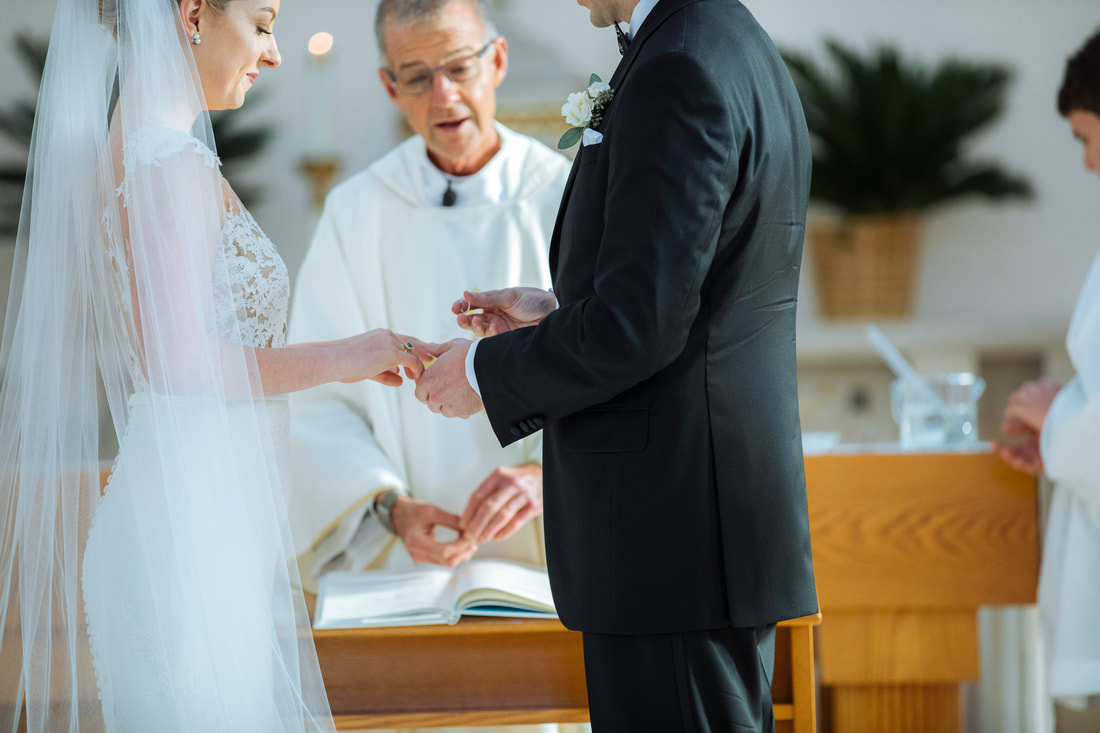 Weddings By Romi, Church wedding, St. Mary's Star wedding, Key West wedding Photographers, Key West wedding Photography, Best wedding Photographers, Bride and groom exchanging the rings